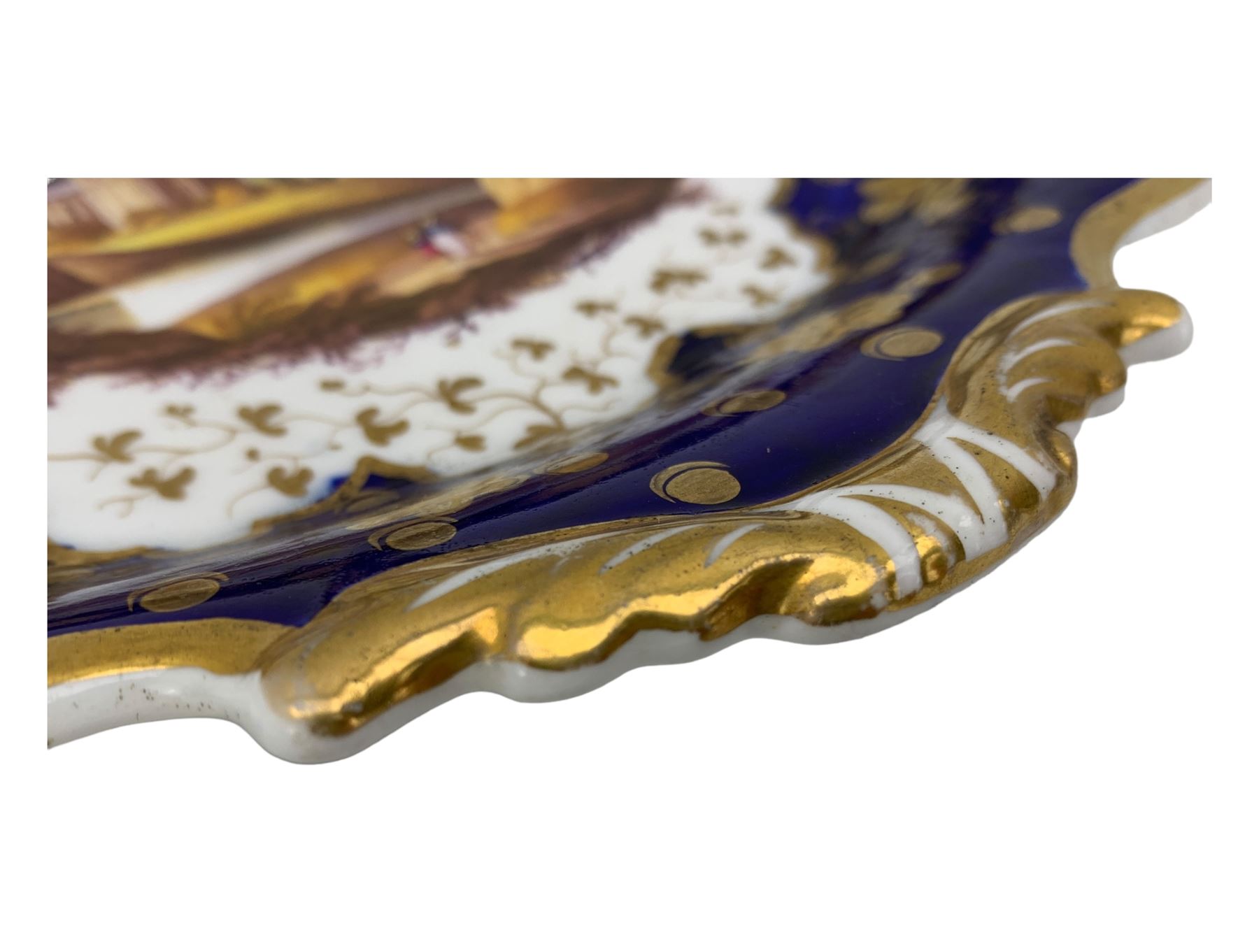 Early 19th century Ridgway twin handled oval dish, hand painted with figures in a river landscape, within a cobalt blue and moulded border, L30cm together with a similar twin handled serving dish, L28cm (2)