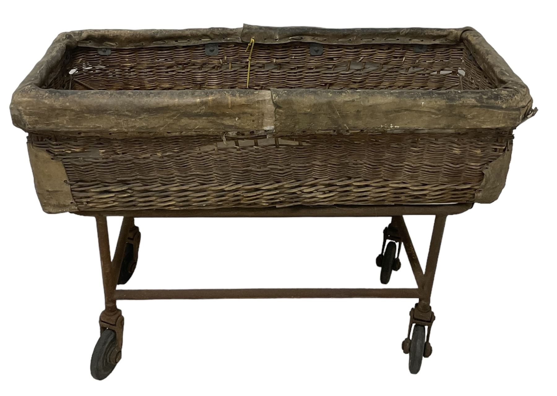 Early 20th century GPO wicker and hide bound postal trolley, on a cast iron base with castors