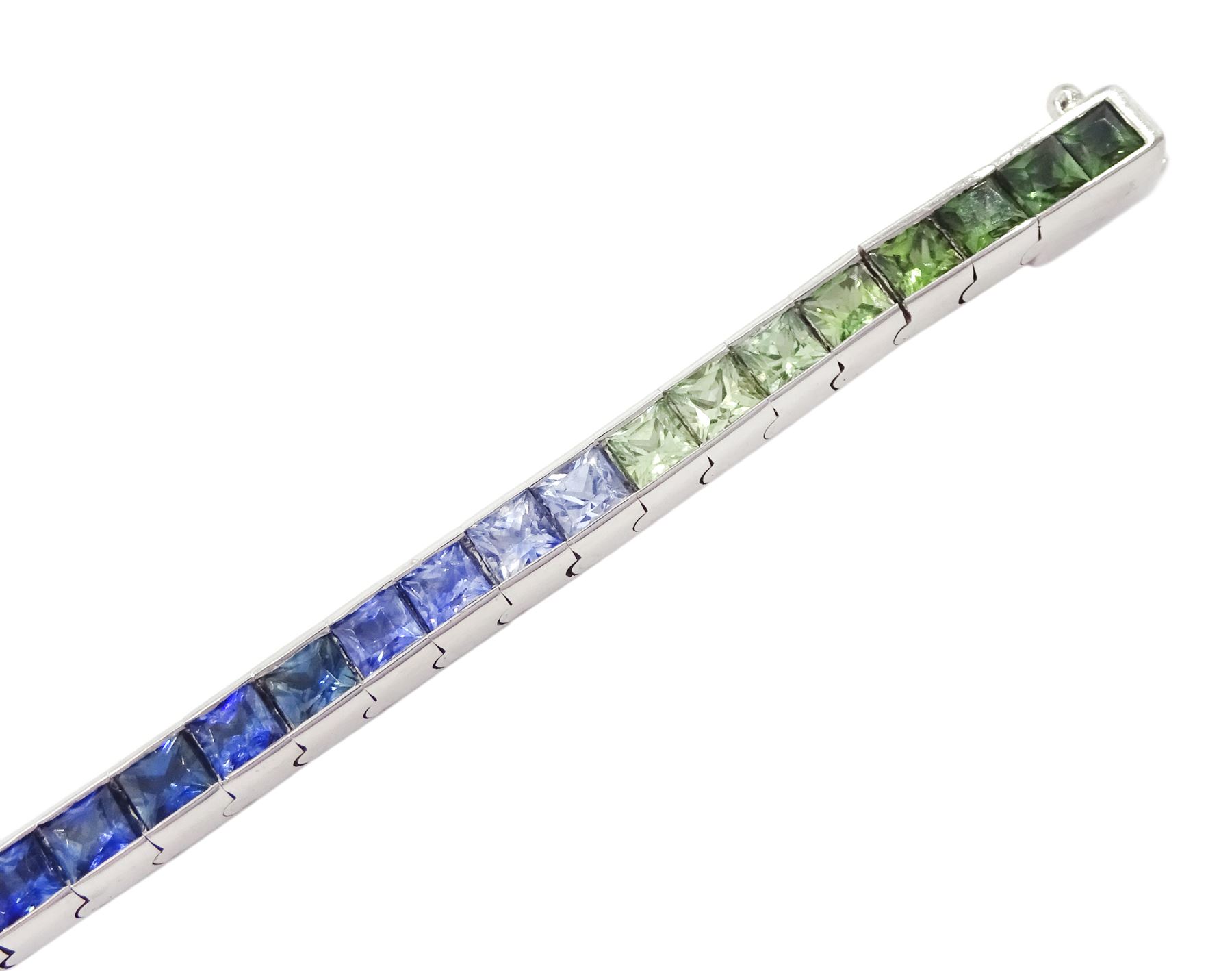 18ct white gold channel set multicoloured sapphire bracelet, sixty-one princess cut sapphires, various hues including blue, pink, green, yellow and teal, London 2004