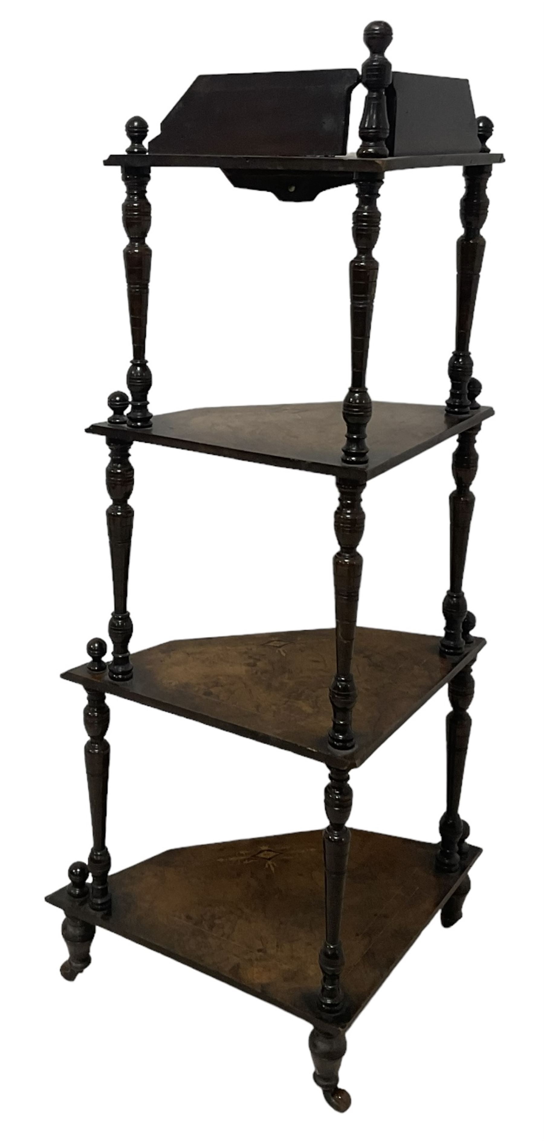 Victorian inlaid walnut corner four-tier whatnot, raised back over four graduating tiers of triangular form, decorated with satinwood and ebony inlays, united by tapering ring turned uprights, on castors