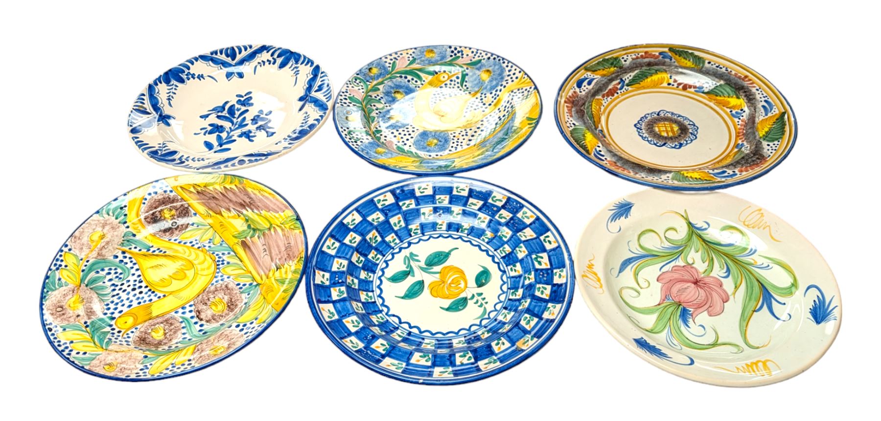 Six Spanish ceramic chargers, painted with bright floral patterns, three marked Lario, largest D35cm