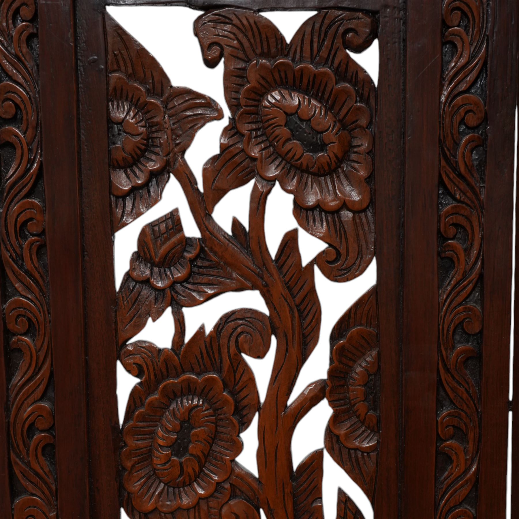 Hardwood five panel screen, carved and pierced with trailing branches and flowerheads 