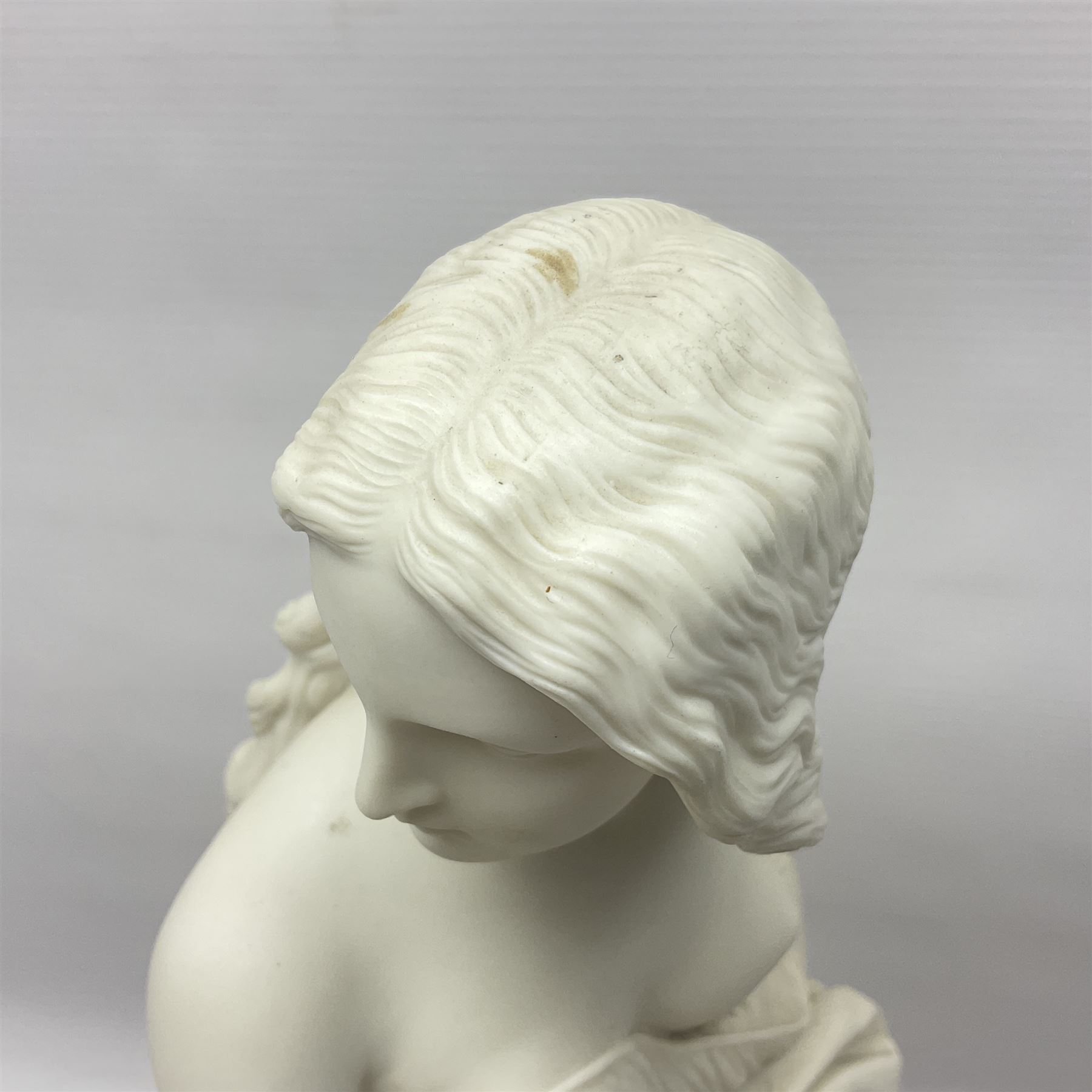 19th century Copeland Parian Ware figure, after R Monti, modelled as Lady Godiva, upon a circular titled plinth, signed and dated verso R Monti 1870, impressed to base Copyright Reserved Copeland, overall H22cm