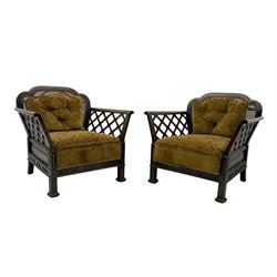 Early 20th century three-piece bergère suite - three seat sofa (W177cm, H82cm, D75cm); pair of matching armchairs (W84cm); single caned back with 'cock-pen' panelled arms, upholstered in foliate pattern fabric, blind fretwork lower frieze over square feet 