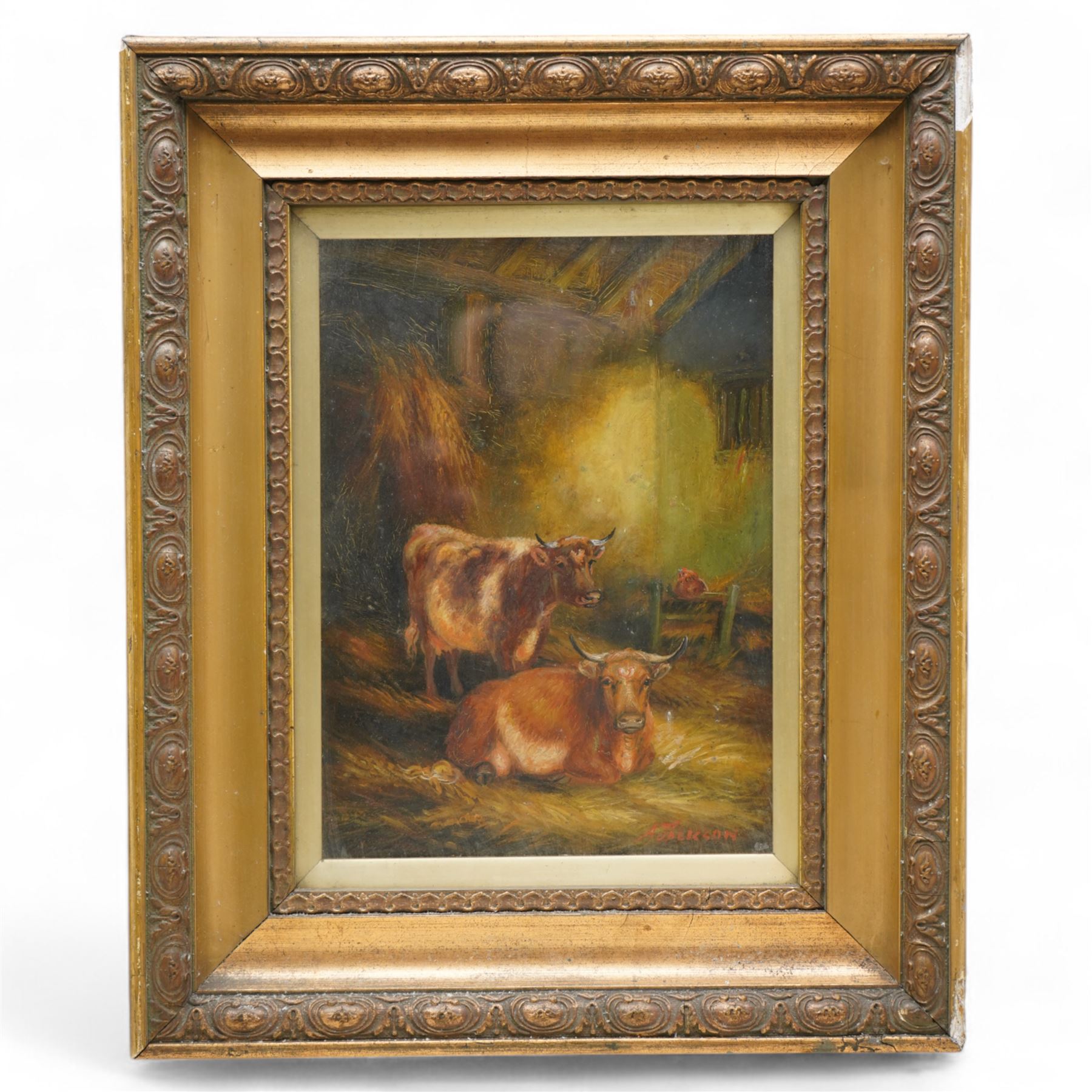 A Jackson (British Early 20th century): Two Horned Cows in a Barn, oil on board signed 26cm x 19cm