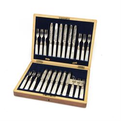 Set of twelve mother of pearl handled silver fruit knives and forks, the knives with flora...