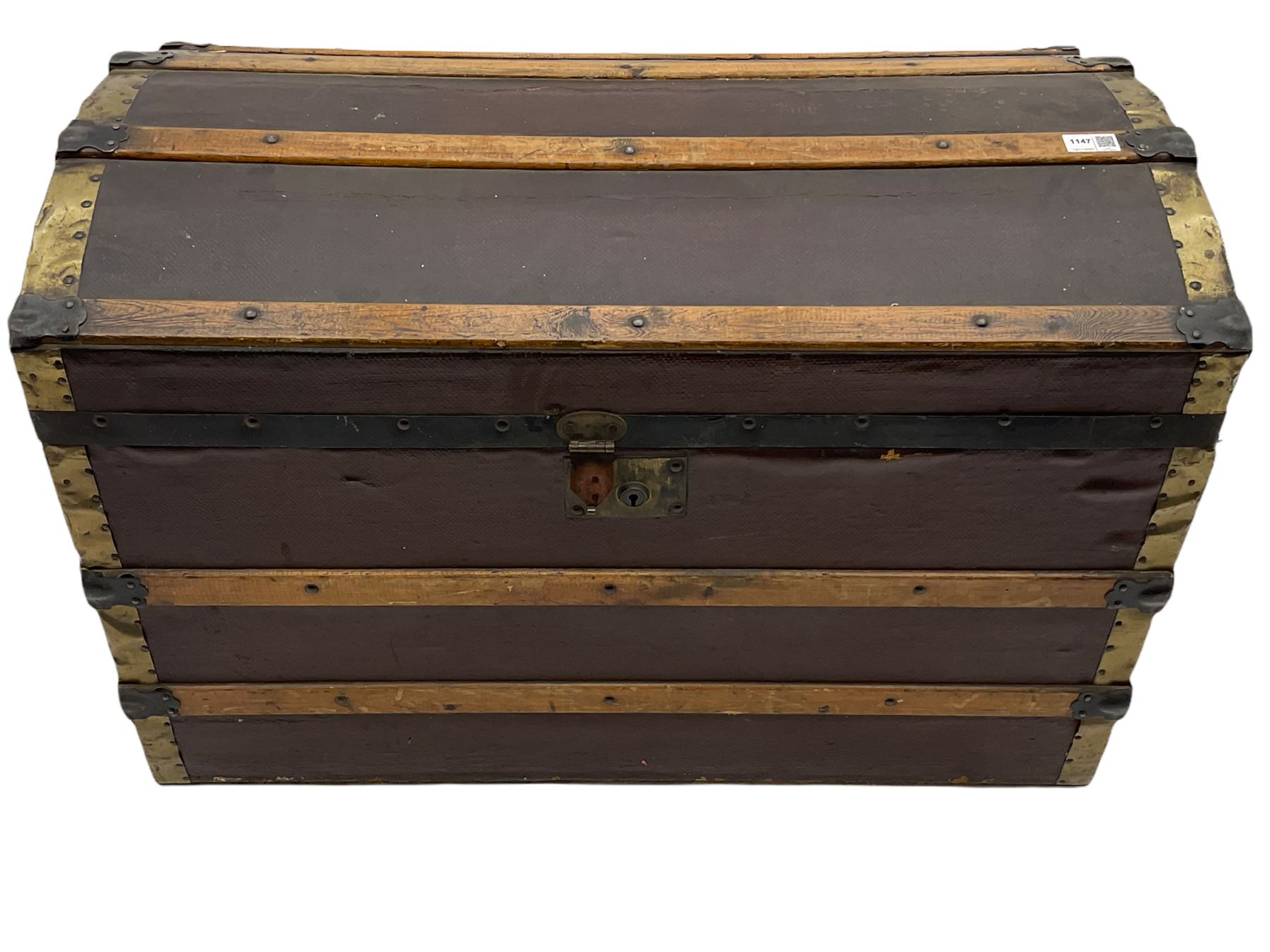 Early to mid 20th century wood and metal bound trunk, with hinged dome lid