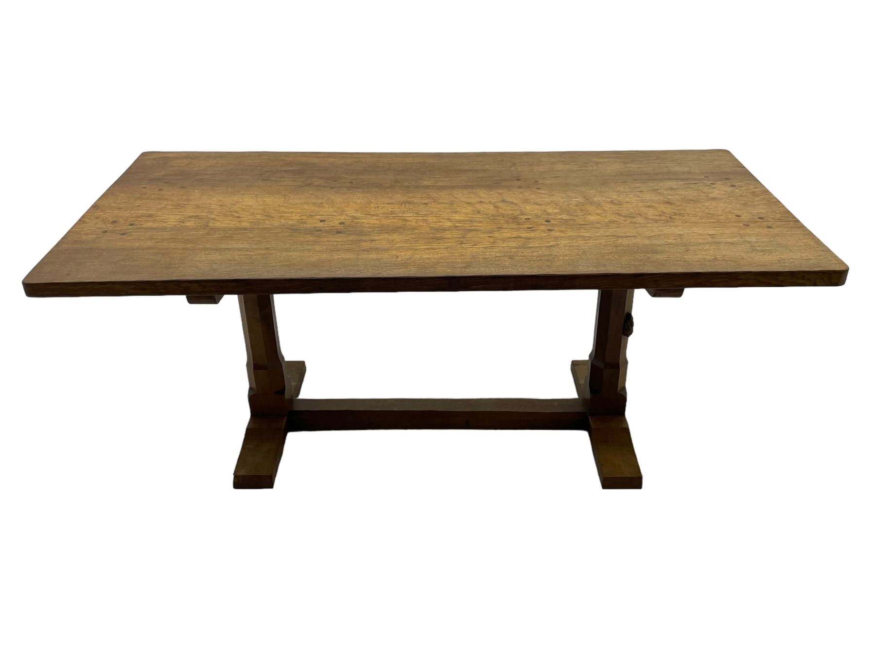 Rabbitman - oak dining table, rectangular adzed top, twin octagonal pillar supports on sledge feet, united by floor stretcher, carved with rabbit signature, by Peter Heap of Wetwang 