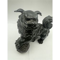 Spelter dog of foo, modelled with one paw placed upon ball, H22cm
