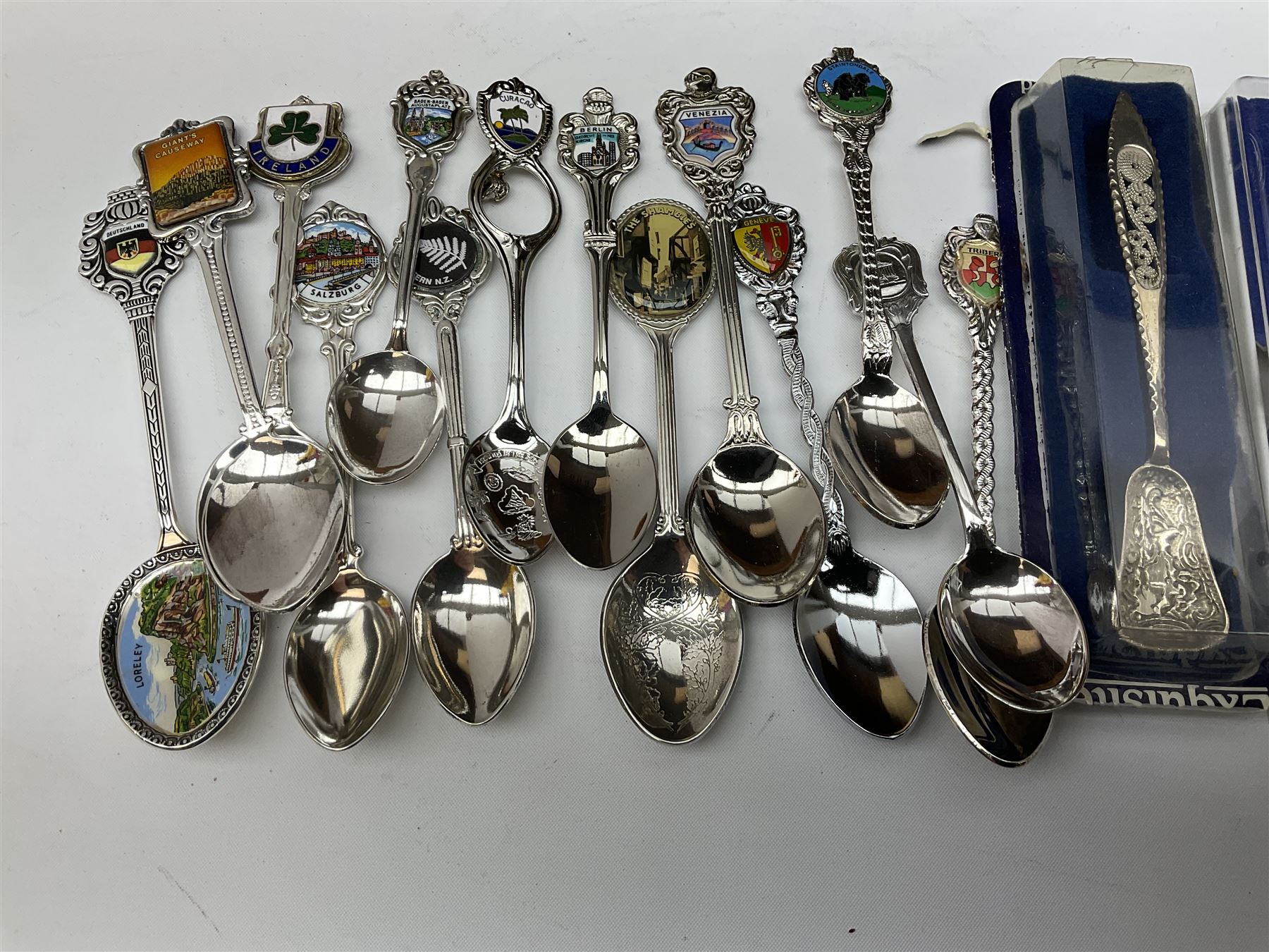 Collection of souvenir teaspoons with wooden display case, H62cm, L53cm. 