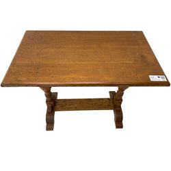 20th century oak occasional table, rectangular top on turned twin pillar supports, carved with squirrel motif, on shaped sledge feet united by stretcher 