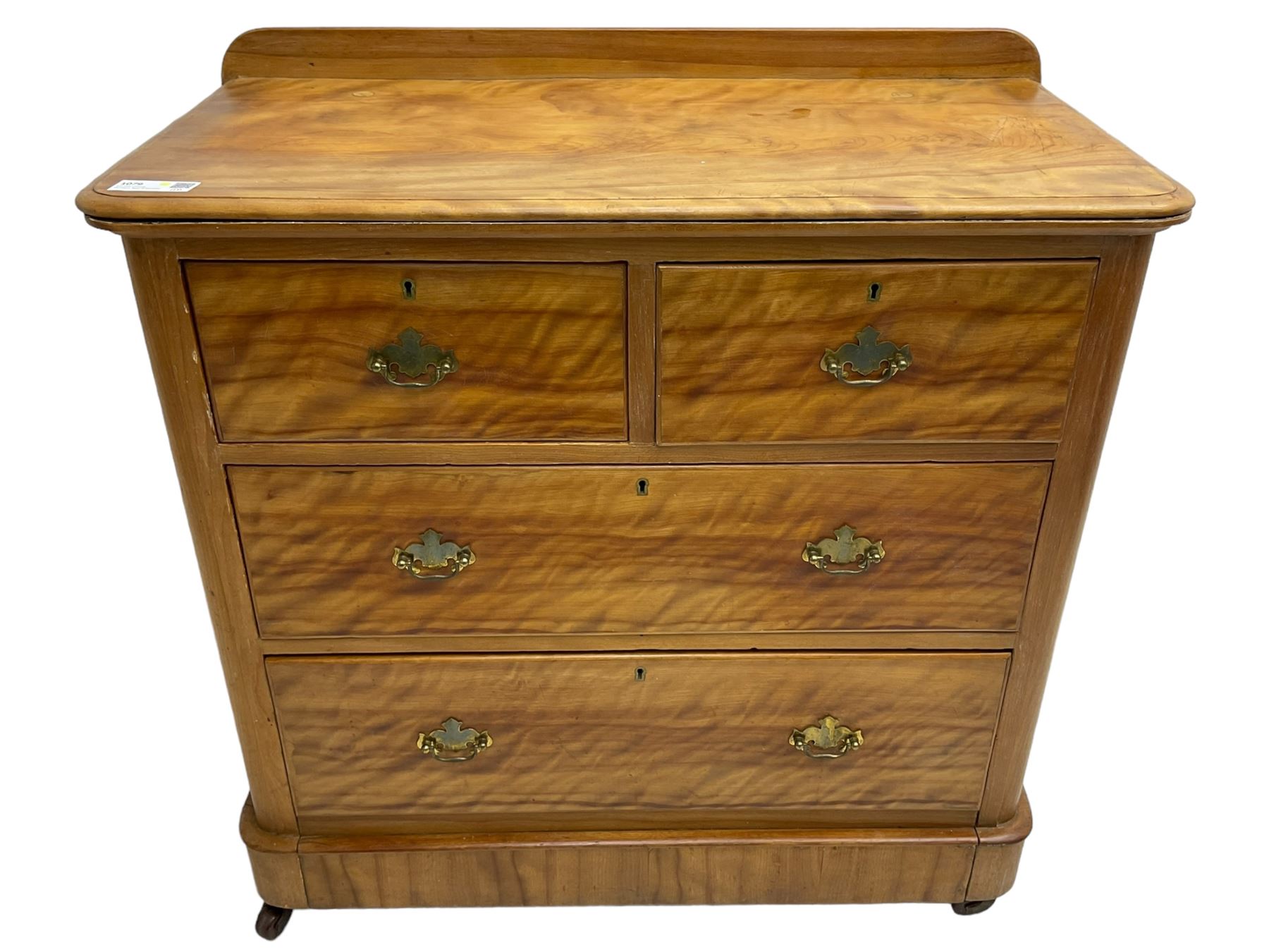 Victorian satin walnut chest, raised back over two short and two long drawers, skirted base with castors