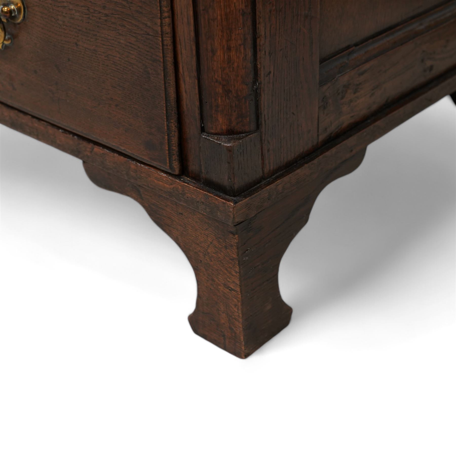 18th century oak chest, rectangular protruding top with moulded edge, fitted with two short over two long drawers, flanked by quarter-canted plain pilasters, raised on shaped bracket feet