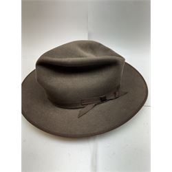 Akubra pure fur felt trilby hat, together with another trilby and two top hats, one by Woodrow and one by Dunn & Co