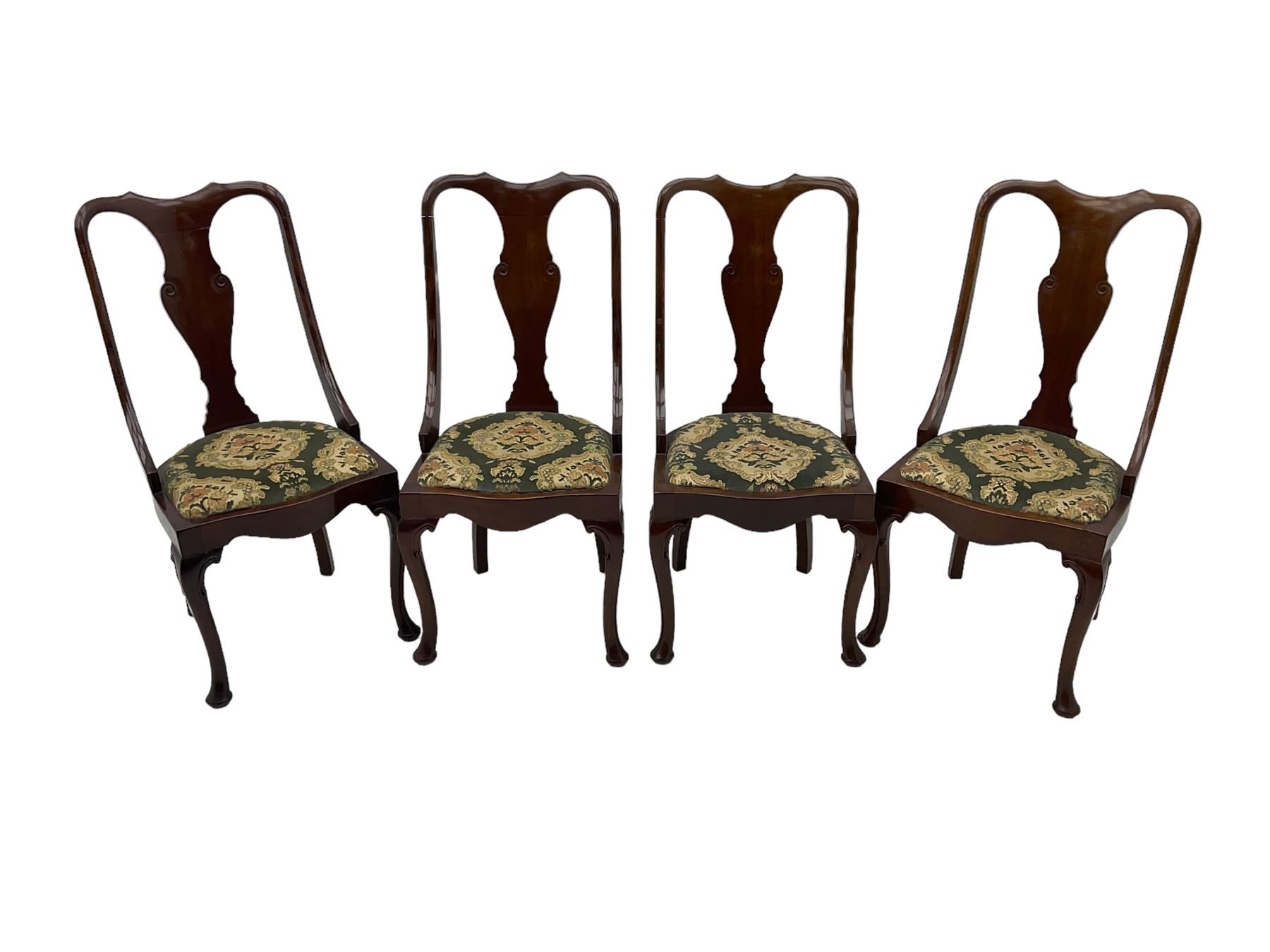 Set of eight late 19th century mahogany spoon back dining chairs, each with shaped top rail over Queen Anne design vase-shaped splat, upholstered seats in floral patterned fabric, raised on cabriole supports with scroll carved knees