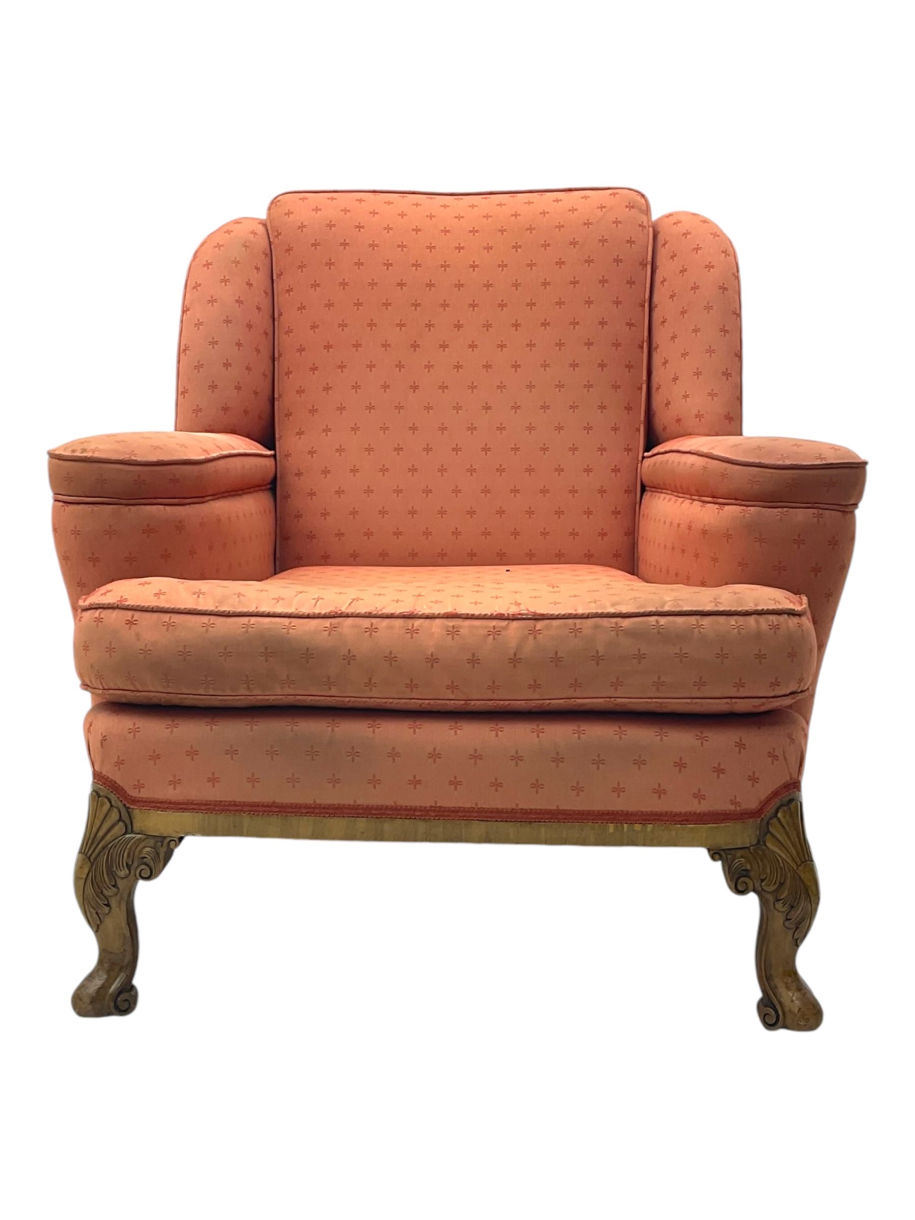 Late 20th century mahogany framed three seat sofa, upholstered in cream fabric with repeating cross pattern, raised on cabriole supports (W192cm, D98cm, H89cm); matching armchair in light pink fabric (W92cm, D98cm, H89cm) 