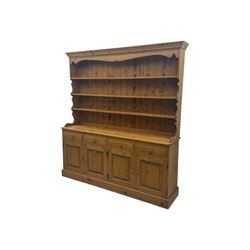 Large traditional pine dresser, shaped cornice over three open shelves, base fitted with f...