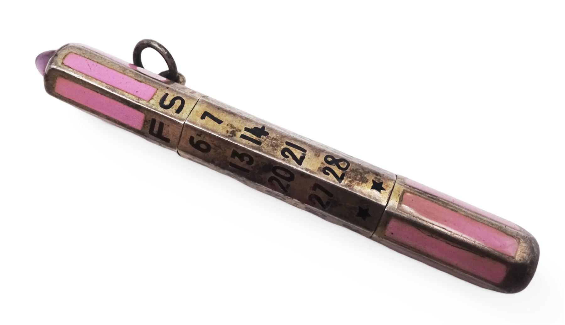 1920s silver and enamel calendar pencil, the silver faceted body decorated with panels of pink enamel with central adjustable calendar to centre, set with purple polished stone to one end, with London import marks for 1927, Cohen & Charles, L6.5cm