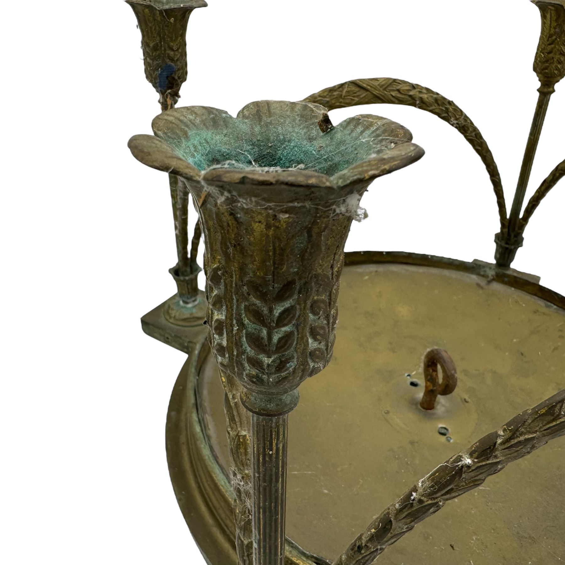 Pair of early 20th century brass plafonniers or ceiling lights, each of circular form with four sconces, joined by four leafy swags, lacking glass shades, W41cm x H28cm approx. (2)