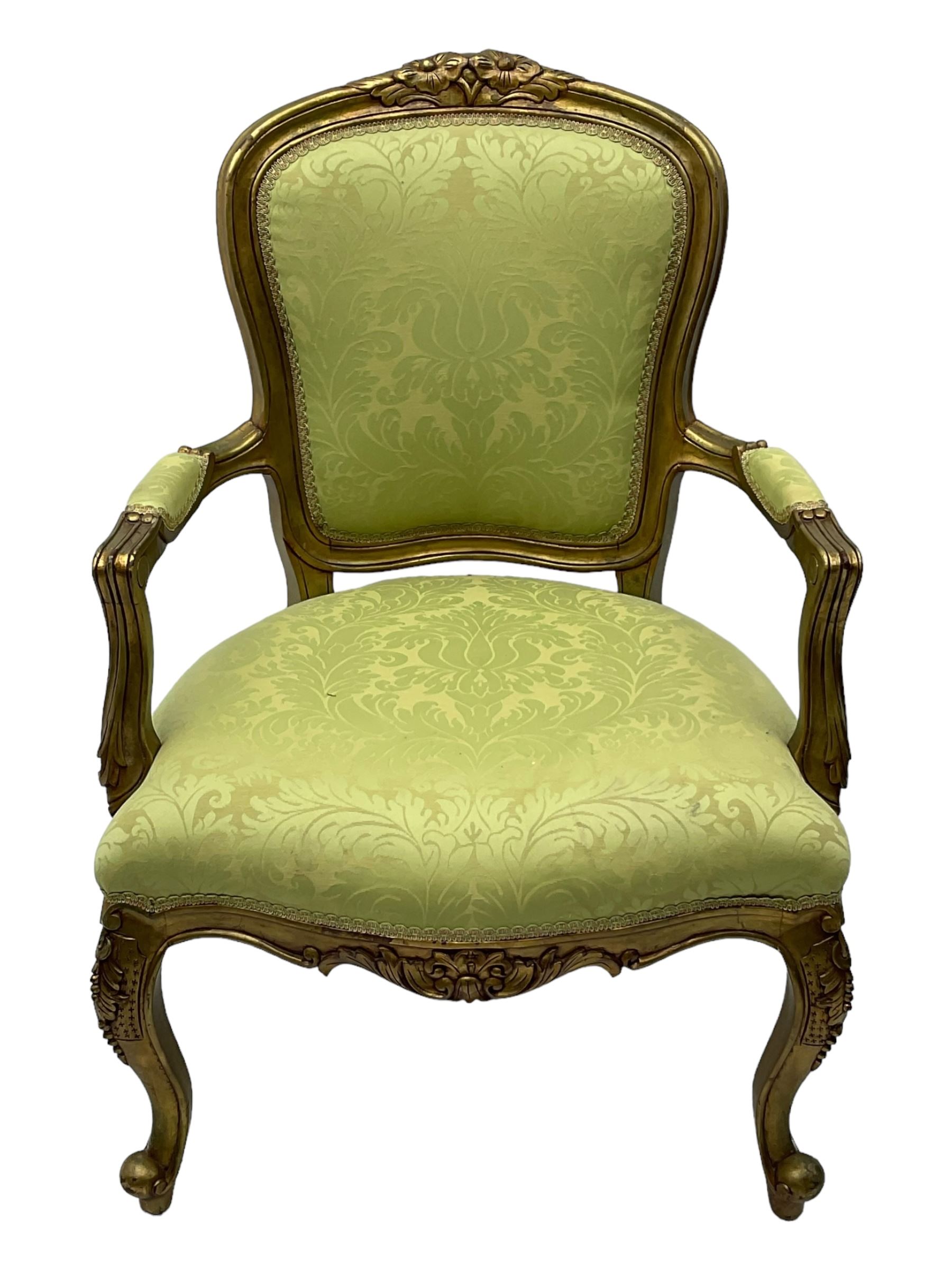 Late 20th century French design gilt framed armchair, upholstered in lime green damask fabric, arched back with carved crest, scroll arms, serpentine front rail, on cabriole front supports with ball feet