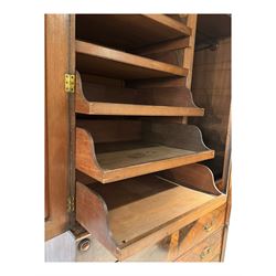 Victorian mahogany linen-press, moulded cornice over two figured panelled doors, the interior fitted with five slides and hanging rail, four long drawers below 