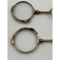 Pair of 14ct gold lorgnettes, marked Dollond London, together with another 14ct gold pair and a 14ct gold miniature magnifying glass embossed with flowers