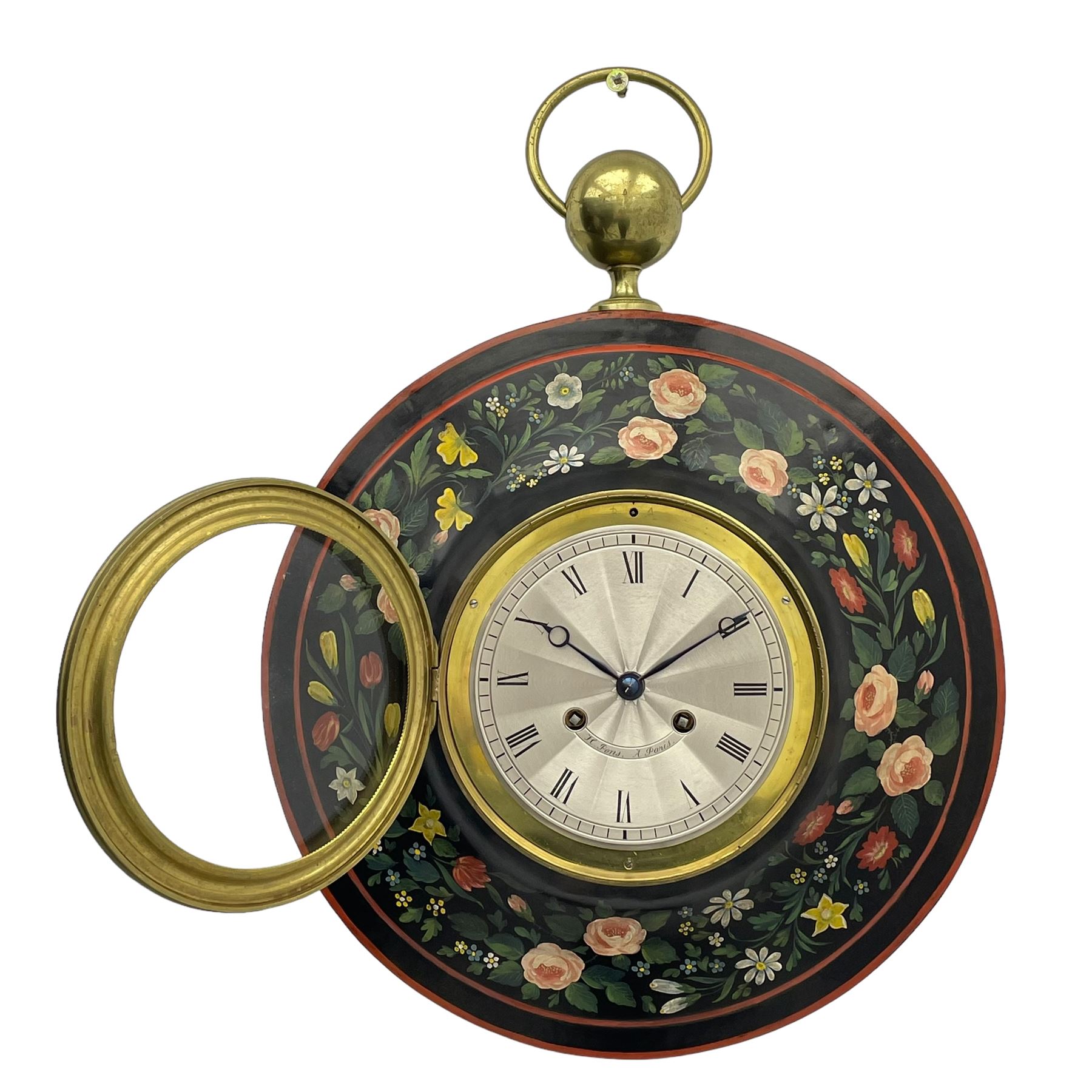 Honore Pons of Paris -  A good and early 19th century Tole Ware wall clock c1830, with a later re-decorated case suspended from a circular brass hanger, cast brass dial bezel and silvered engine turned dial with roman numerals, minute track and steel moon hands, 8-day twin train countwheel striking movement with a silk suspension, striking the hours and half hours on a bell. With pendulum and key.
