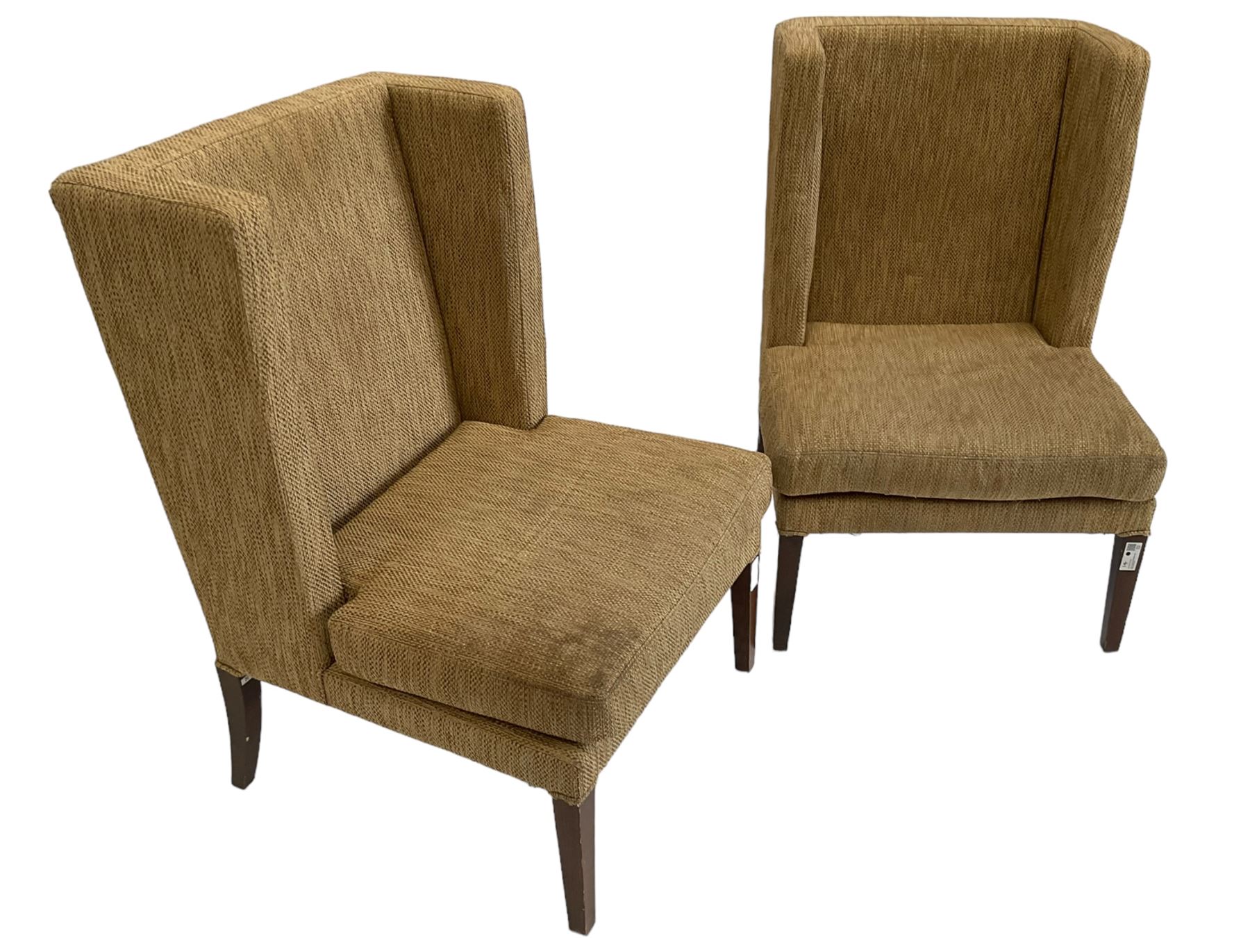 Two wing back armchairs, upholstered in oatmeal fabric