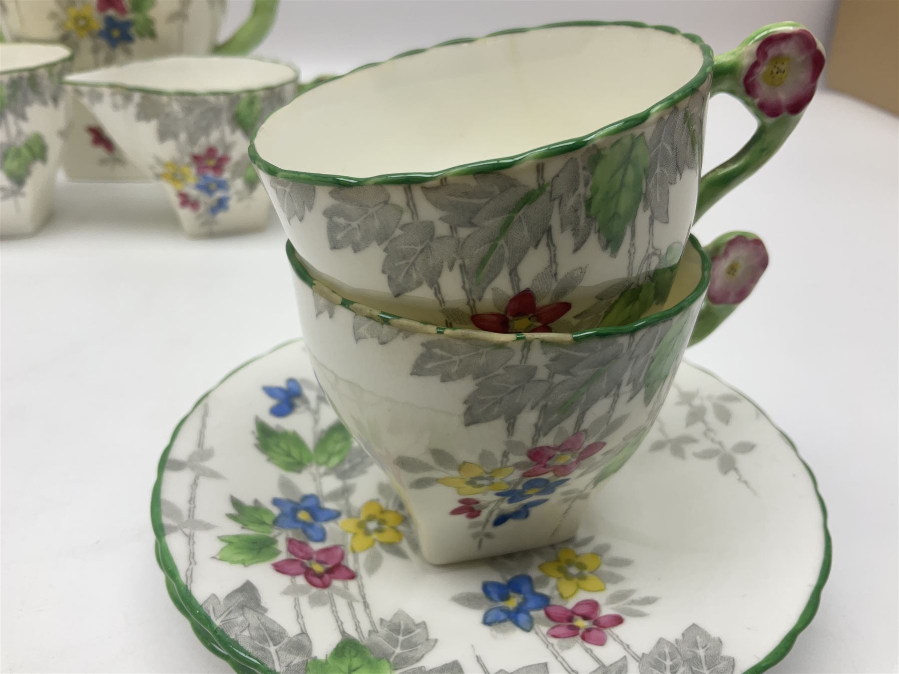 Art Deco Delphine China coffee service for six, comprising coffee pot, open sucrier, milk jug, cups and saucer, with floral decoration