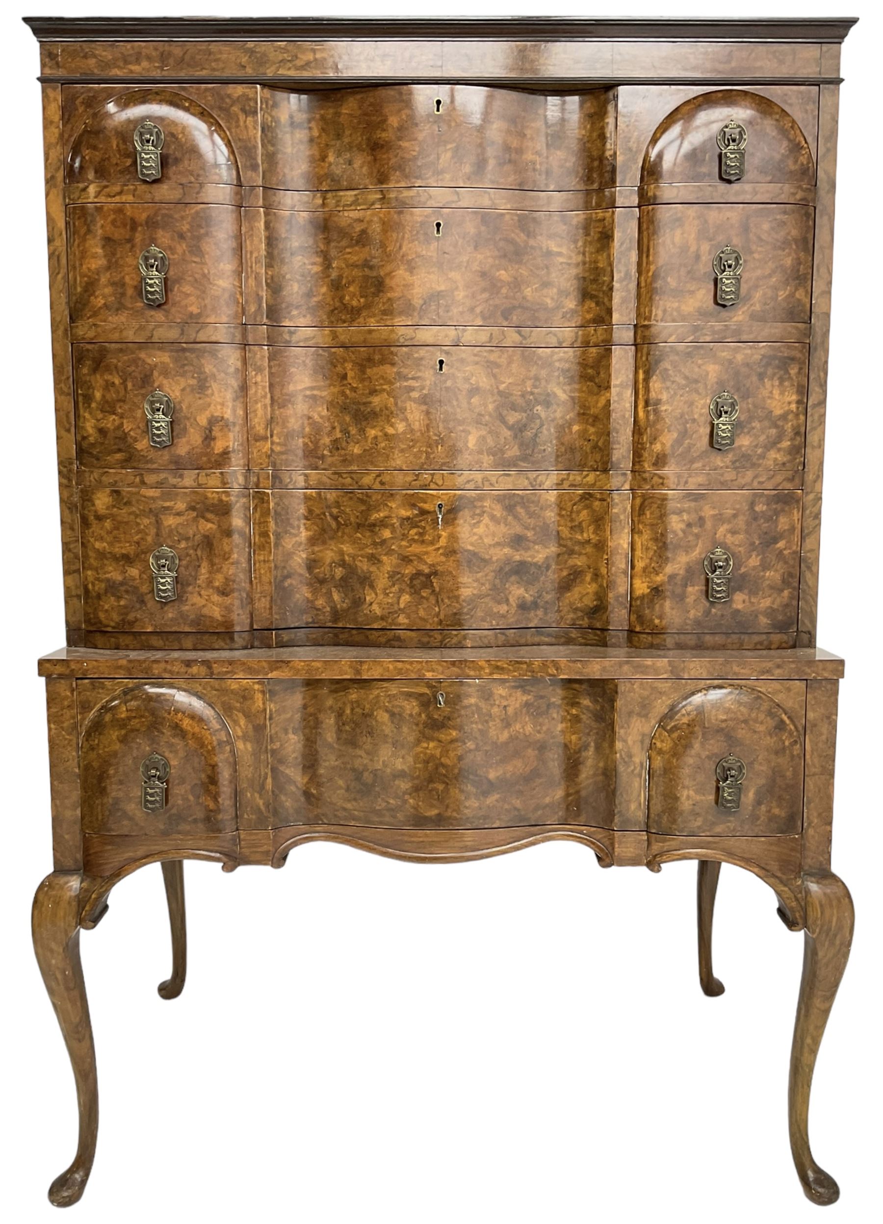 Early to mid-20th century figured walnut chest on stand, four graduating drawers on stand fitted with single drawer, drop handles in the form of shields with three recumbent lions, on cabriole supports