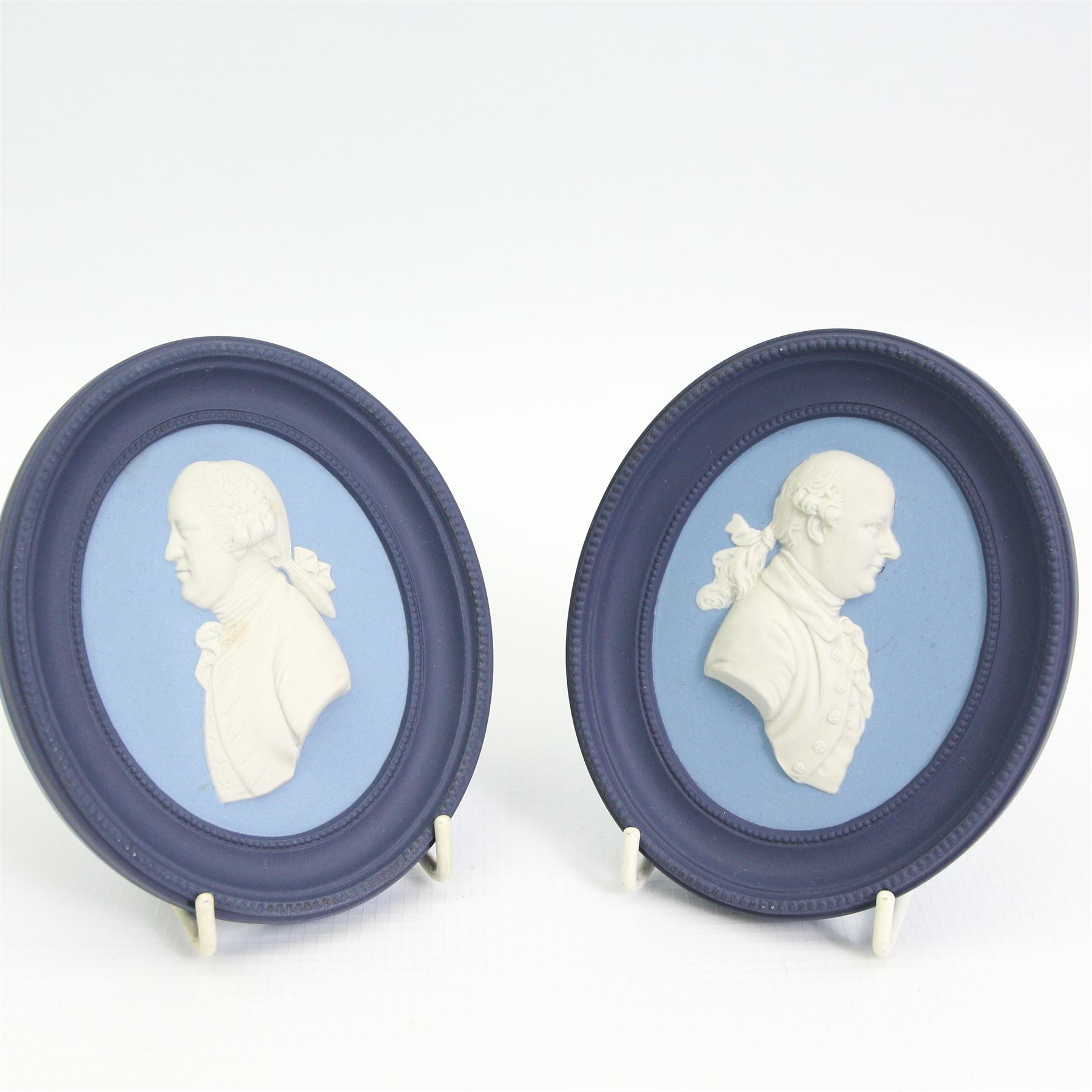 Wedgwood Jasperware miniature tea set for one, on a matched tray, oval scent bottle with silver cover, four caddy spoons, miniature bell, seven thimbles, together with a cased pair of portrait medallions of Josiah Wedgwood FRS and Thomas Bentley 