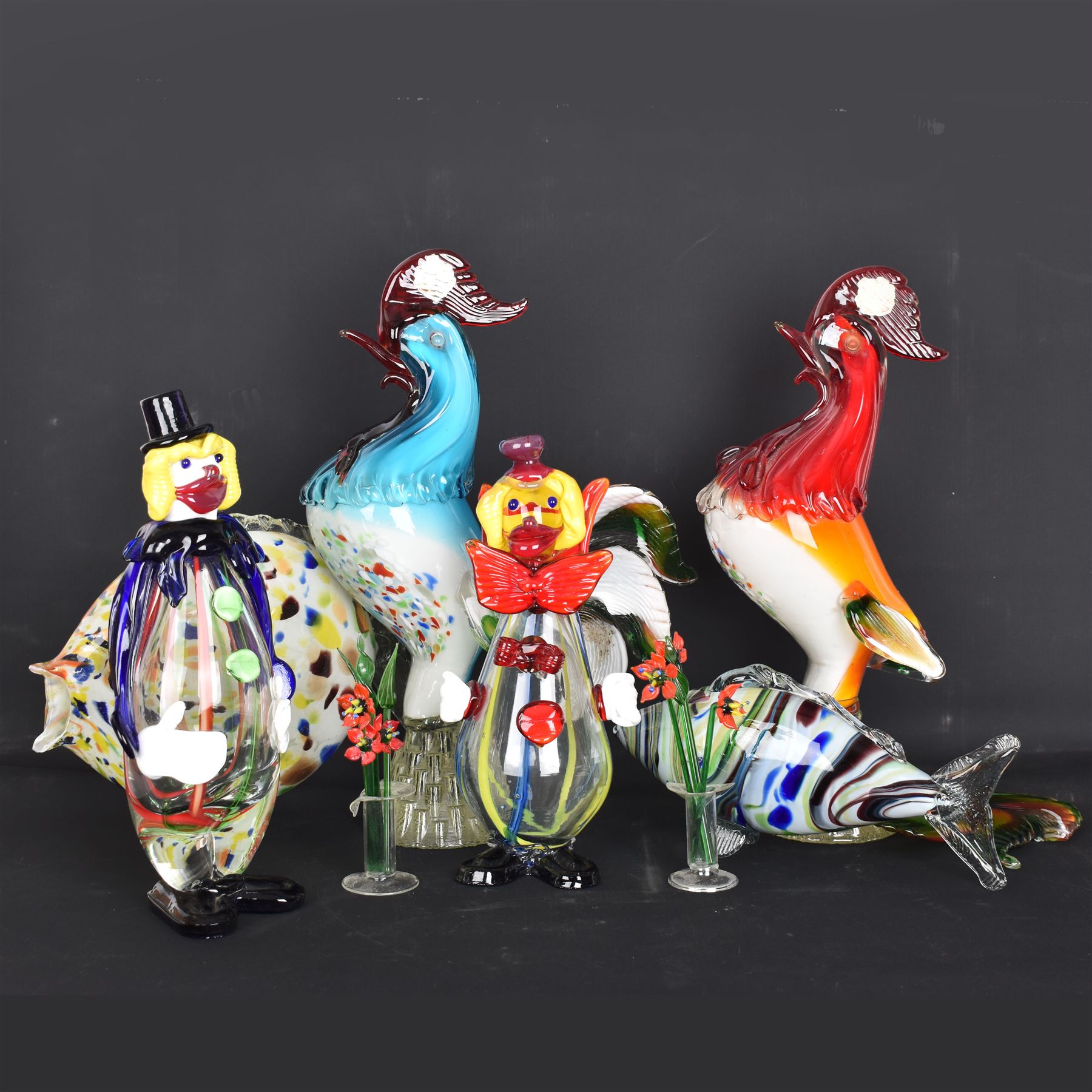 Two Murano glass clowns, together with similar glass figures, including cockerels and fish