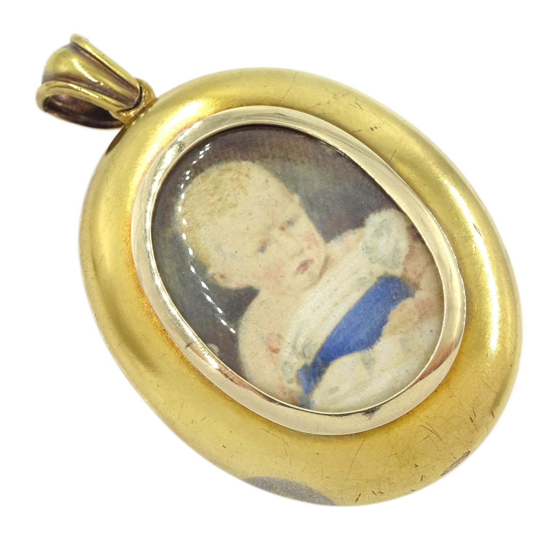 Victorian gold locket, the applied wirework decoration set with garnets, pearls and a paste yellow stone, with glazed reverse