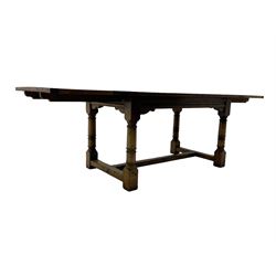 Oak refectory dining table, rectangular three plank top with cleated ends, two additional leaves, on turned supports united by H-stretchers 