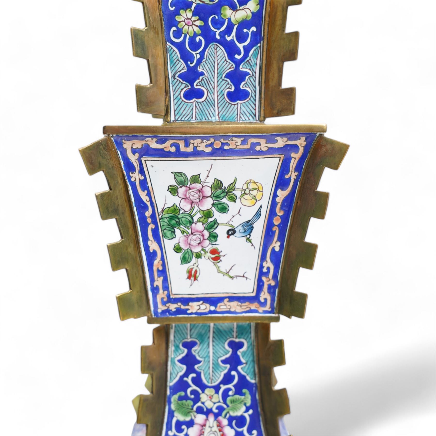 20th century Chinese brass and enamel Zun form vase, decorated with figures and birds in panels, lappet borders and trailing foliage against a blue ground, on pierced rectangular stand, H38cm