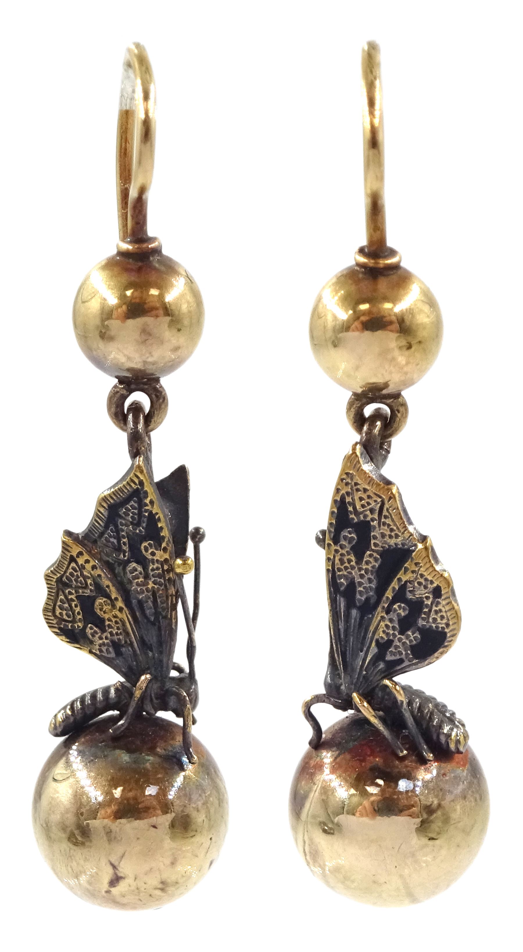 Pair of 19th / early 20th century white and yellow gold butterfly pendant  earrings, the 18ct gold butterflies suspended between two 14ct gold spheres, in fitted velvet and silk lined box