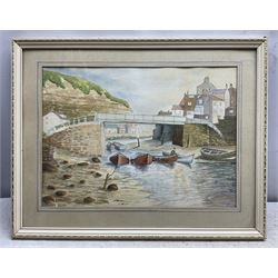 F Preston (British 20th Century): 'Staithes - The Beck', watercolour signed, titled and dated 1977 verso 17cm x 37cm; Roy Williams (British 20th Century): 'Robin Hood's Bay', charcoal signed and dated '92, 21cm x 30cm; together with a watercolour of barges signed 'Turner' (3)