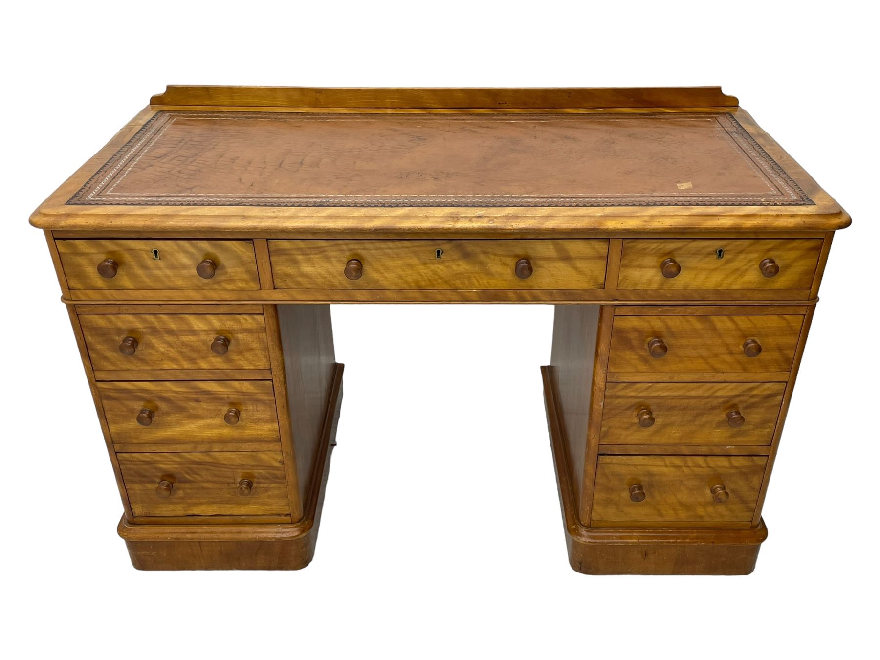 Victorian satin walnut twin pedestal desk, moulded rectangular top with rounded corners and raised back, inset leather writing surface with tooled borders, fitted with nine drawers with turned handles, on moulded plinth base 