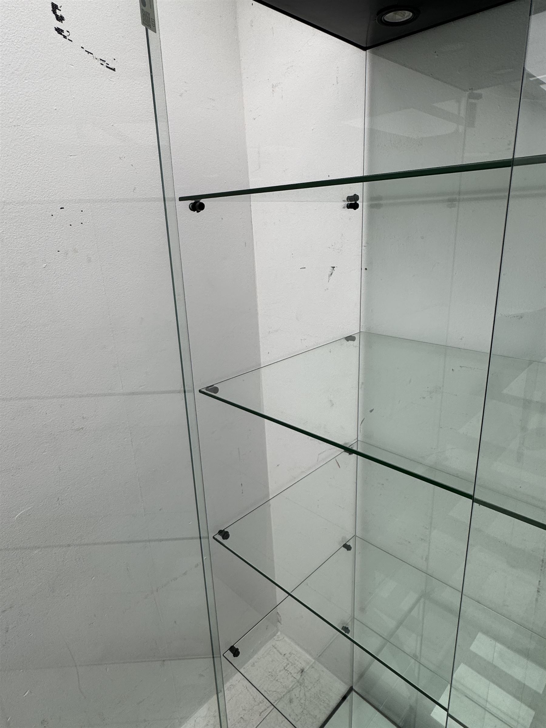 Glazed shop display cabinet fitted with two doors, six shelves with illuminated interior