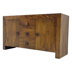 Contemporary Dakota mango wood sideboard, plain rectangular top over three central drawers flanked by cupboards with shelving, each with square pulls, raised on stile supports