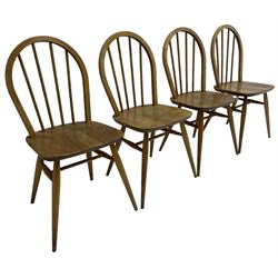 Ercol - circa. 1950s set of four 'Windsor' elm and beech stick and hoop back chairs