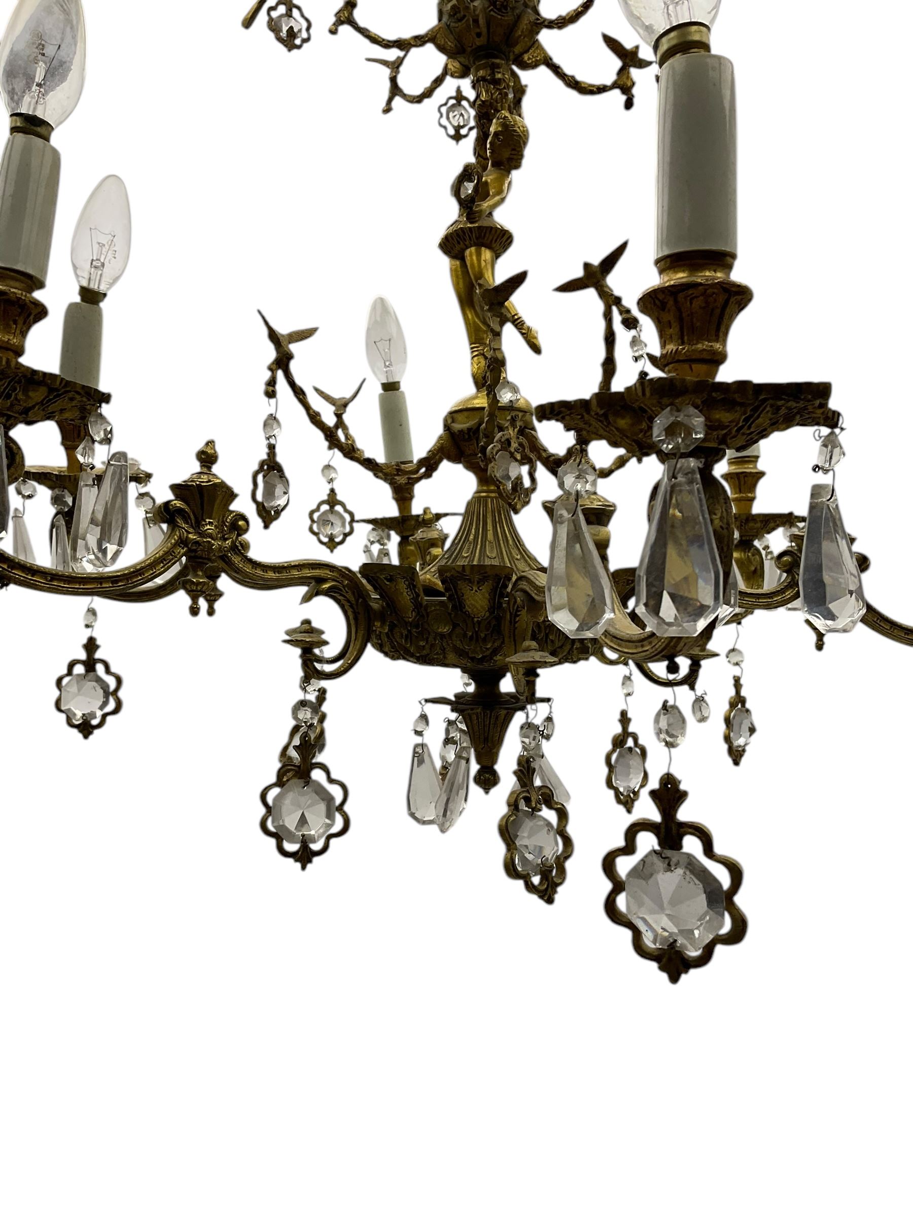 Gilt metal six branch ceiling light, the central stem modelled as a ballerina, decorated with glass pendants 