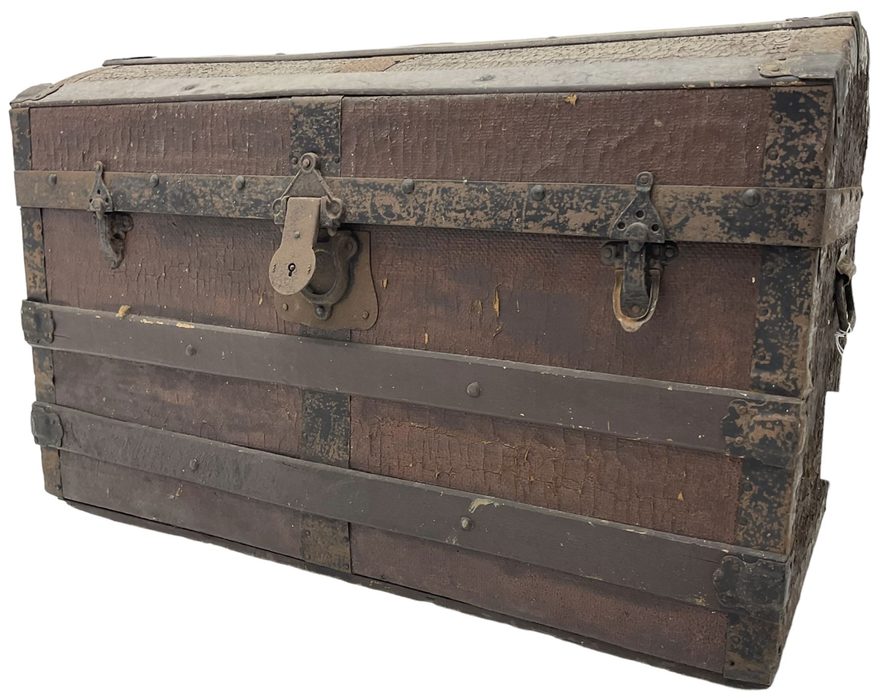 Late 19th to early 20th century leather and wood bound chest with metal fixtures 