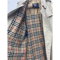 Ladies Burberry double breasted trench coat, with belt and detachable woollen gilet, in traditional cream colour with Burberry check lining, together with a gentlemans Burberry single breasted trench coat, both L112cm