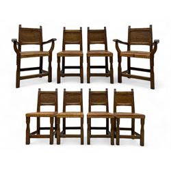 Gnomeman - set of eight (6+2) oak dining chairs, adzed panelled back over tan leather upholstered seat with applied stud band, on square supports united by plain stretchers, each chair carved with gnome signature, by Thomas Whittaker, Littlebeck, Whitby