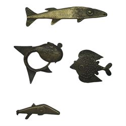 Fourteen Ashanti brass and other metal gold weights, modelled as various fish, including Silure fish, one example bearing label stamped Sotheby's 3 Dec 1984, largest example L8cm