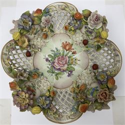 19th Meissen style centrepiece, with pierced lattice work sides and decorated in relief with fruit and floral sprigs, upon four scrolled feet, with spurious mark beneath H9cm D31cm