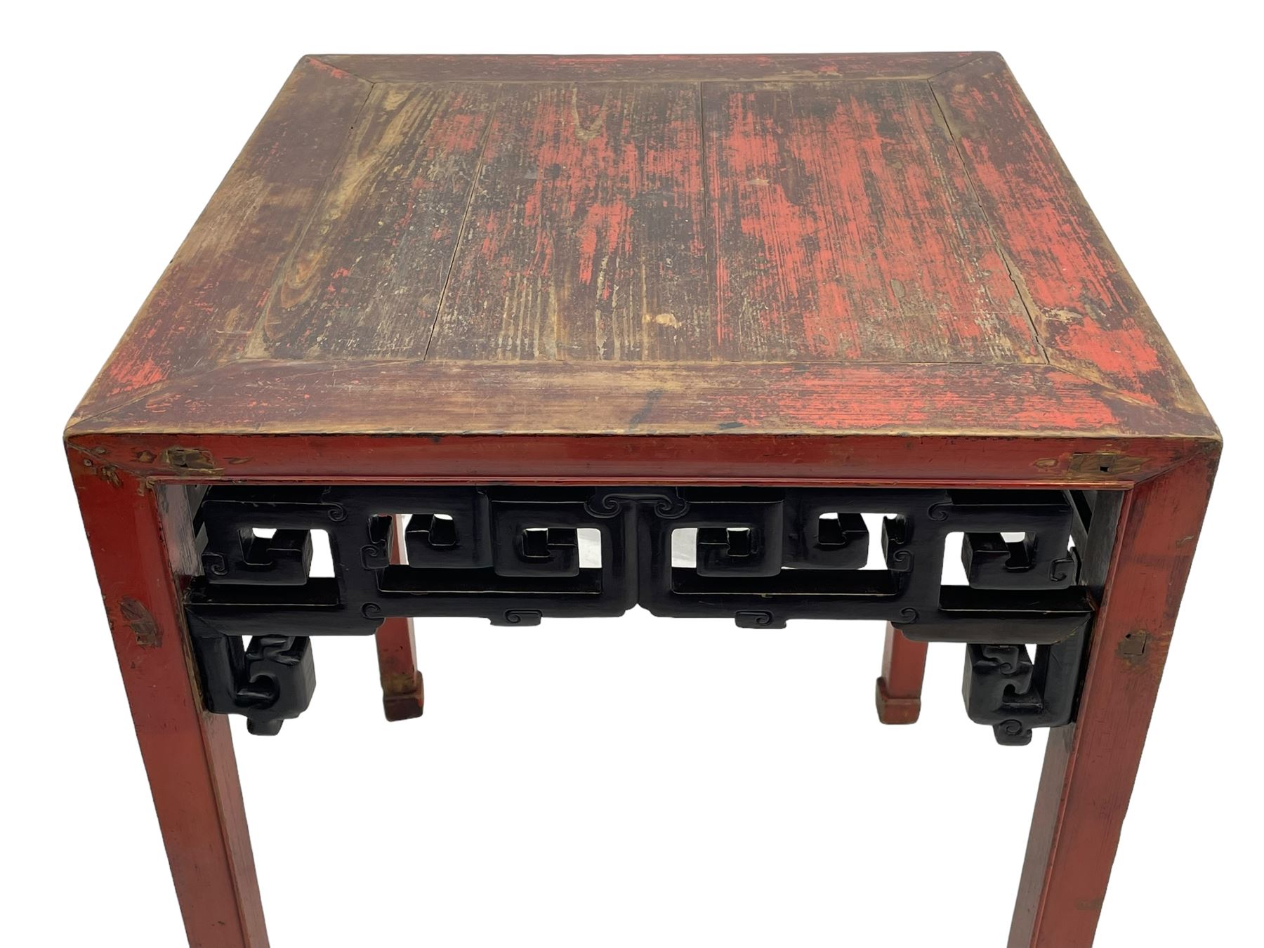 Late 19th century Chinese Qing dynasty red and black lacquered wood tall tea table, Shanxi region, square top over geometric scroll fretwork panels, on square supports with hoof feet 