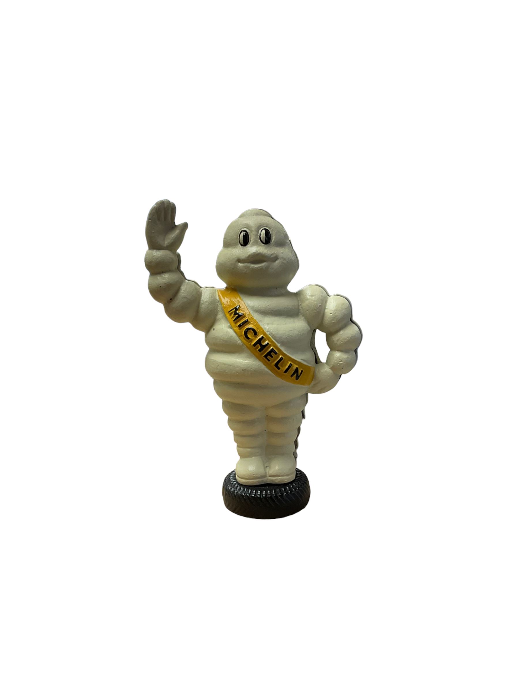 Cast iron money box figure of Michelin Man, stood on a tyre, H24cm