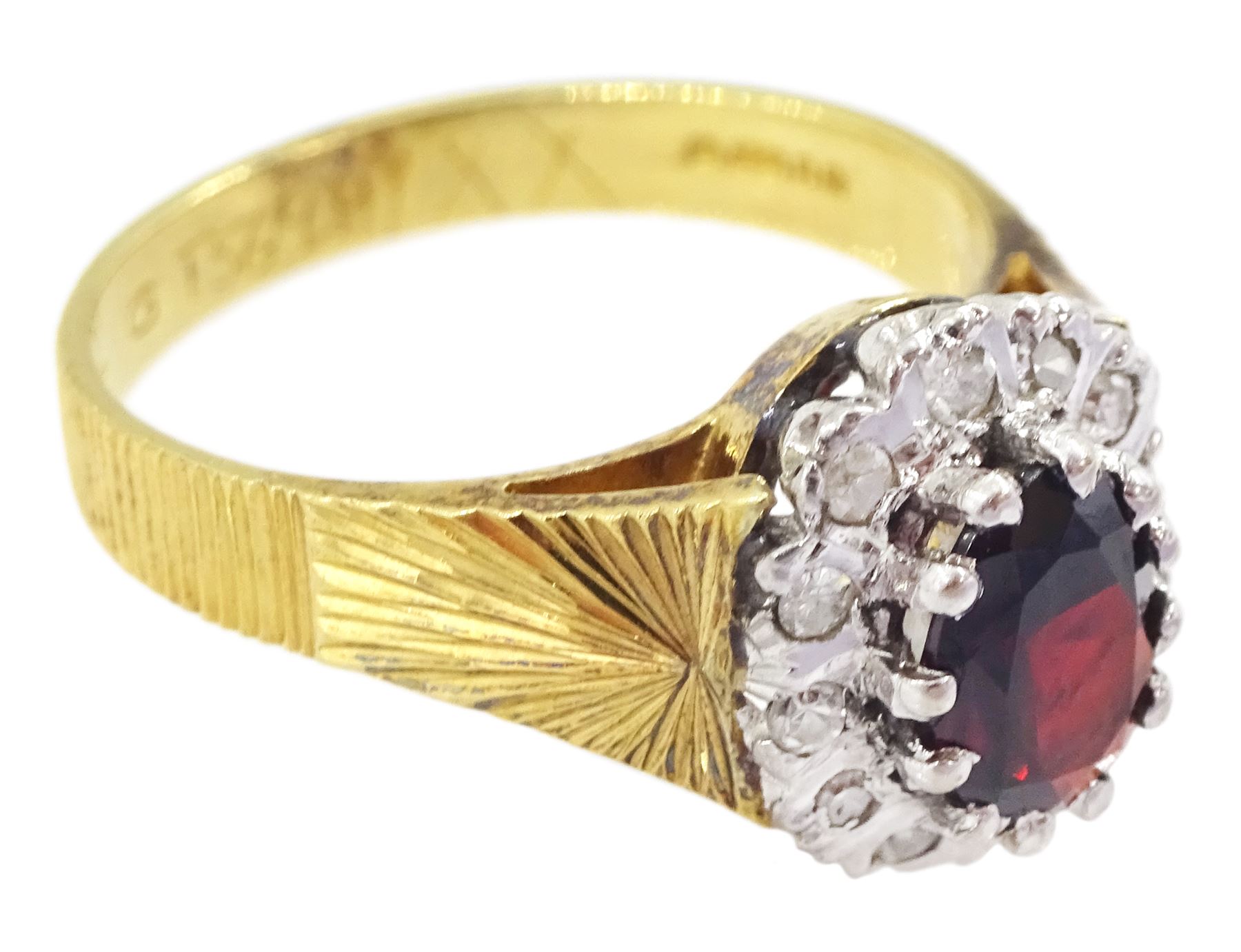 18ct gold oval cut garnet and diamond cluster ring, London 1975